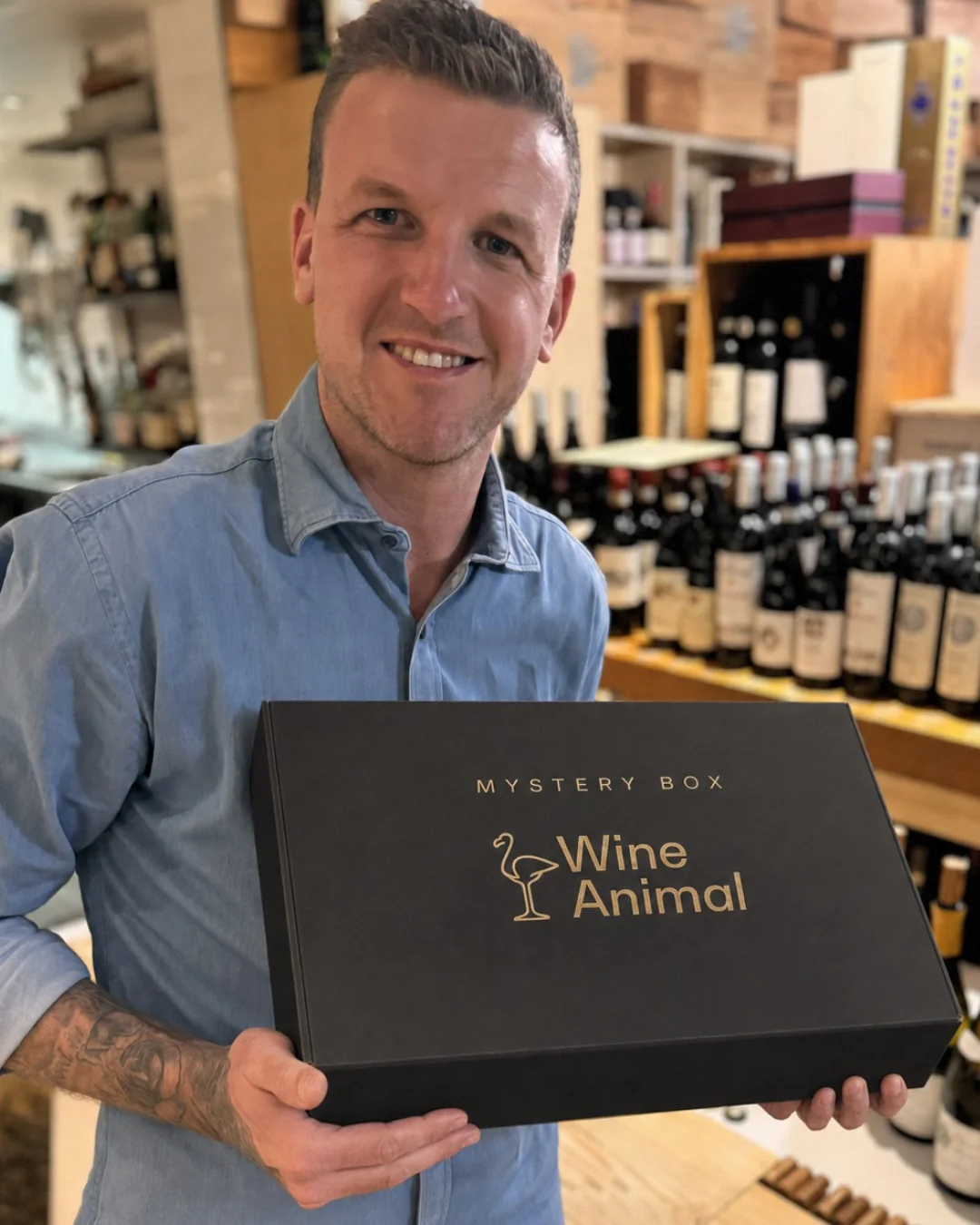 Brenden holding a Wine Animal Mystery Box